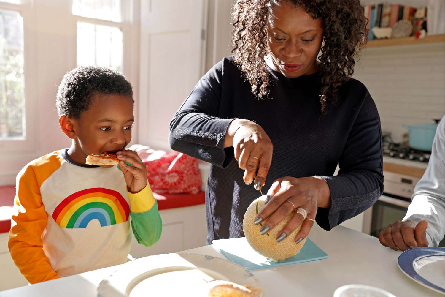 mom and son with healthy eating habits having fruit