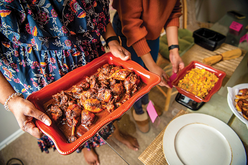 two people platters of food