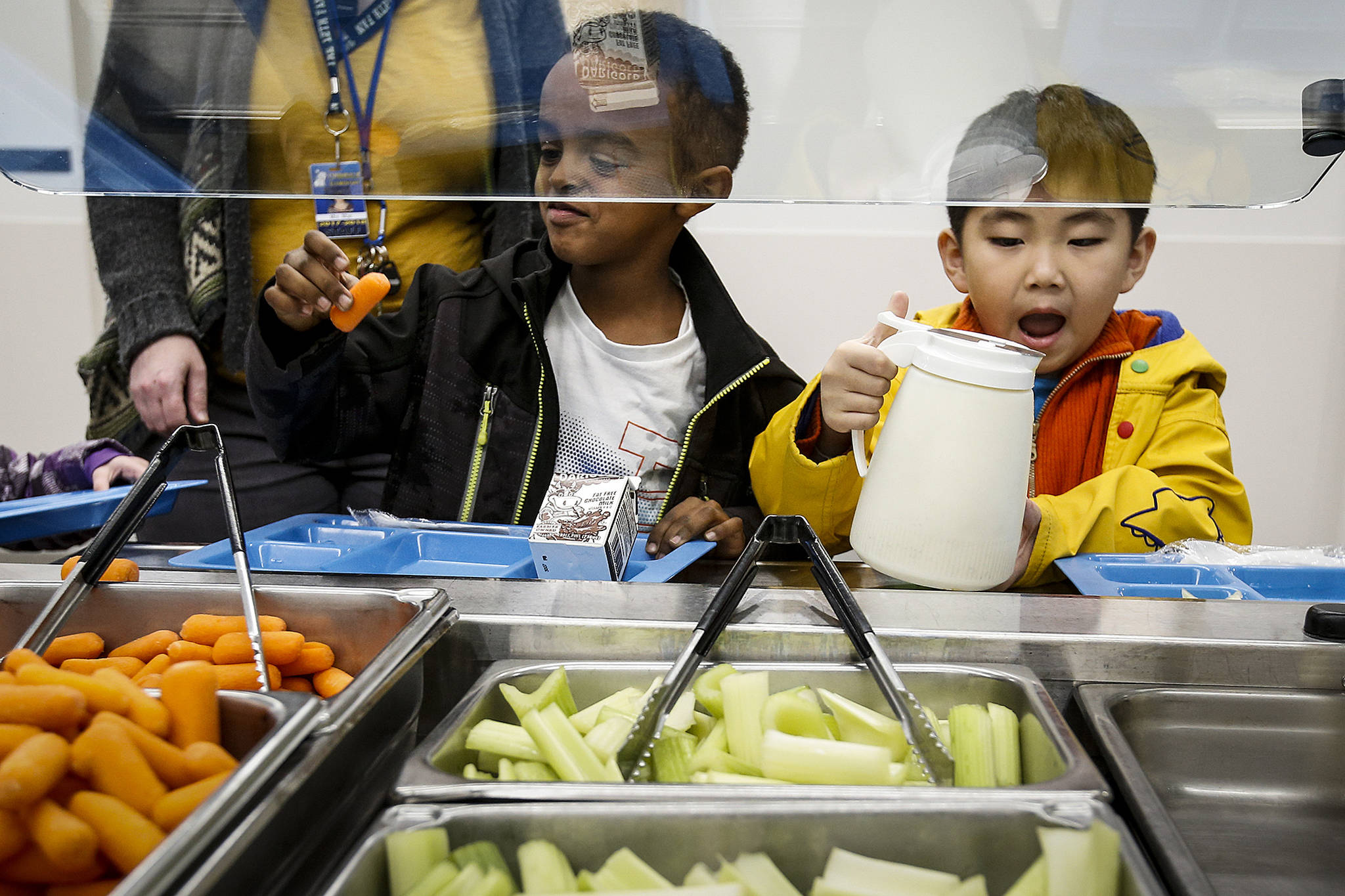 two boys in line at school salad bar